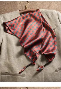 Elegant silk scarf featuring classic equestrian print, stylish triangular design for women.