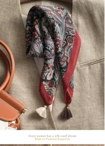 Elegant paisley print small square scarf with fringe detail, delicate fabric accessory.