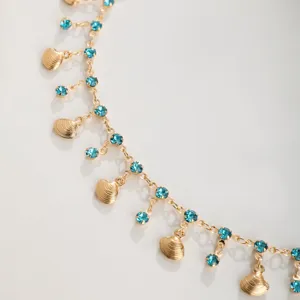 Gold seashell and blue rhinestone chain necklace, delicate summer beach choker jewelry.
