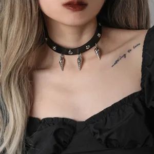 Gothic black leather choker necklace with metal spikes and shell pendants, punk style.