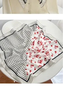 Detailed close-up of a stylish square scarf with split black polka dots and red floral print.