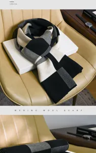 Vue détaillée de l'écharpe en tricot de laine mérinos d'hiver avec un motif à carreaux noir et blanc.