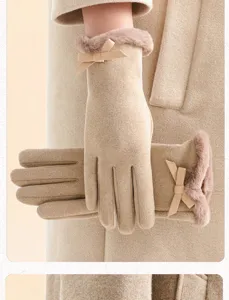 Close-up detail view of winter warm gloves featuring plush cuffs and cute bow decor.
