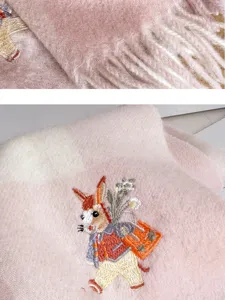 Pink plaid wool cashmere scarf with cute animal embroidery and fringe detail for winter.