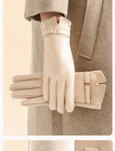 Women plush warm winter suede gloves detail shot with elegant metal buckle decoration