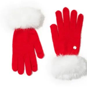 Red knitted gloves with fluffy white faux fur cuffs and a chic metal charm for women.