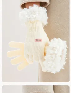 Detail shot of women's winter knit gloves with soft fleece cuffs and cozy touch design.