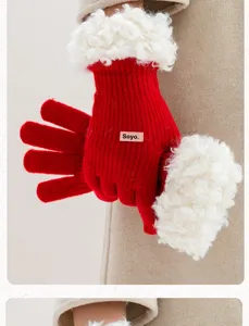 Red winter knit touch screen gloves for women with cozy white faux shearling cuffs detail.