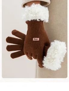 Brown knit gloves with white fluffy cuffs, warm winter touch screen gloves detail view.