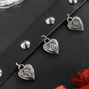 Gothic punk black leather choker necklace featuring metal studs and carved heart pendants detail.