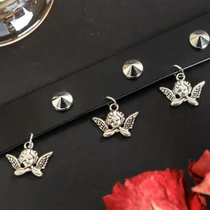 Gothic black leather choker necklace with metal rivets and cute angel pendant details.
