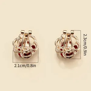 Detailed close-up view of the exquisite gold-toned floral earrings with sparkling rhinestones.
