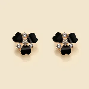 Elegant black heart flower stud earrings with sparkling rhinestones and gold-tone metal setting.