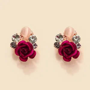 Close-up detail of exquisite rose flower earrings sparkling crystal rhinestones and pink pearl beads