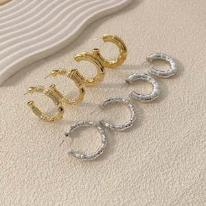 Chic metallic bamboo hoop earrings set in gold and silver, stylish fashion jewelry for women.