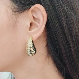 Gold teardrop hammered earrings for women, elegant minimalist fashion jewelry accessory.