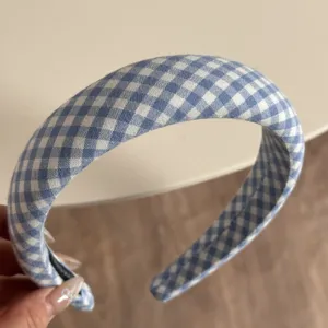Blue and white gingham headband detail showcasing soft fabric texture and curved design for daily wear.