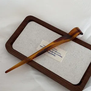 New Chinese style amber acetate hairpin detail shot, elegant daily hair bun accessory for women.