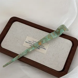 Elegant green acetate hair stick with gold texture, perfect for traditional hair buns and daily wear.