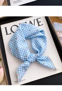 Blue checkered cherry print silk square scarf, versatile neckerchief accessory for wear.