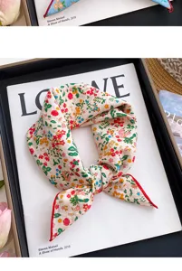 Floral print square scarf detail view, elegant lightweight neck accessory for women.