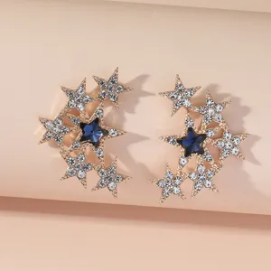 Elegante goldene Stern-Ohrringe mit blauem Kristall und funkelnden Strasssteinen für Damen.