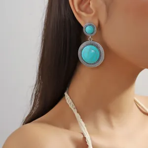Bohemian turquoise drop earrings featuring a stunning double round silver metal design.