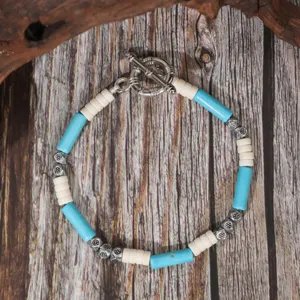Vintage turquoise coconut shell beaded bracelet detail shot, ethnic style handmade jewelry.
