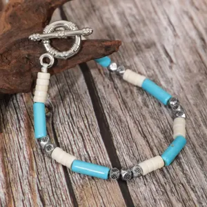 Detailed view of the vintage ethnic turquoise coconut shell beaded bracelet with toggle clasp.