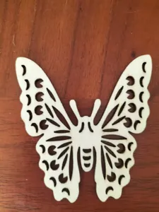 Wooden hollow butterfly pendant for creative home decoration and DIY craft projects.