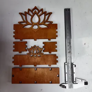 Wooden lotus card holder components detail view, precision parts display for desktop decor.