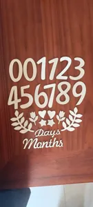 Wooden baby monthly milestone number sign and letters set for photography props detail view.