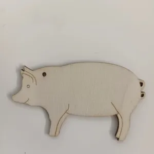 Close-up detail of the blank wooden pig shaped DIY craft pendant hanging tag showing smooth surface.