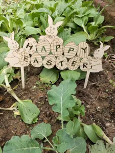 Wooden Easter bunny egg garden stake decoration for yard lawn outdoor holiday party setup.