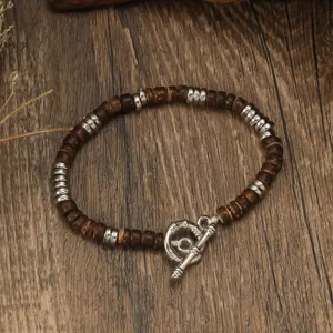 Vintage coconut shell beaded bracelet with metal accents and OT clasp detail for daily wear.