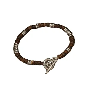 Vintage coconut shell beaded bracelet with sterling silver toggle clasp for stylish unisex wear