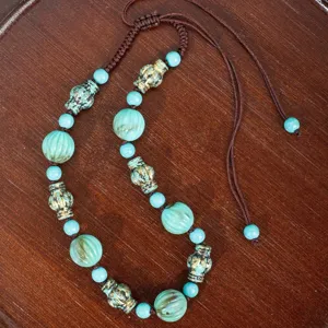 Bohemian vintage turquoise beaded necklace, handmade ethnic style statement jewelry piece.