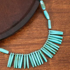 Bohemian turquoise beaded necklace detail, vintage ethnic style, handmade choker jewelry.