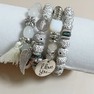 Bohemian multi-layer beaded stretch bracelet with wing charm and sweet love tag for daily wear.