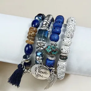 Bohemian multi-layer beaded bracelet with tassel and love charm for women daily wear.