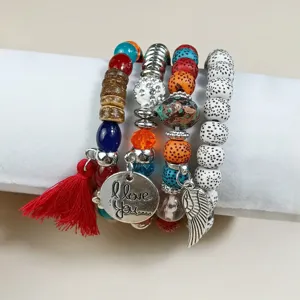 Bohemian multi-layer stacked beaded bracelet set with retro design, colorful beads, and cute charms.