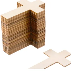 Close up of wooden cross pieces showing natural plywood texture, ideal for DIY crafts.