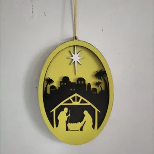 Wooden Nativity scene hanging ornament detail, oval Christmas decoration with Bethlehem star.