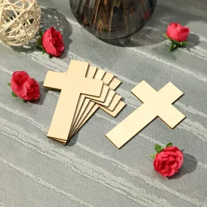 Close-up of unfinished wooden cross pieces for DIY painting and kids craft decoration.