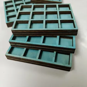 Miniature wooden grid shelf detail, blue finish compartment display for small mineral specimens.