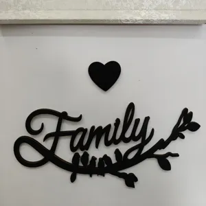 Wooden Family wall art detail showing cut-out letters and cute bird branch decor