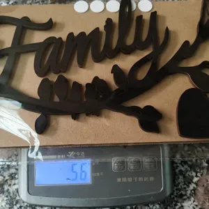 Wooden Family wall decor detail shot showing product weight on scale, perfect for home decoration.