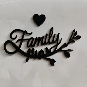 Black wooden Family wall decor detail with cute birds and heart design for cozy home.