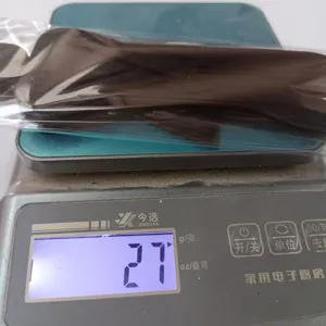 Close-up detail showing the packaged product being weighed on a digital scale for accuracy.