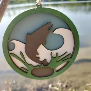 Detailed view of wooden fish pendant hanging outdoors, ocean style multi-layer design.